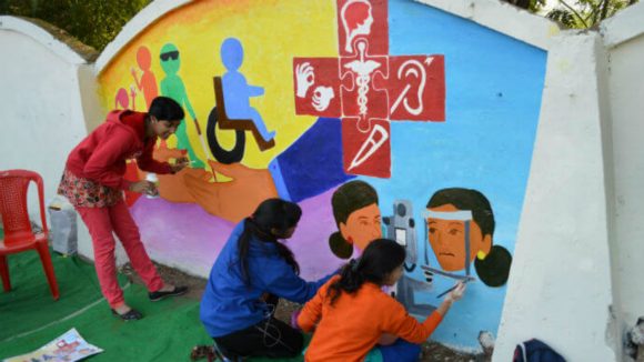 A mural being painted by art students in Bhopal, India.