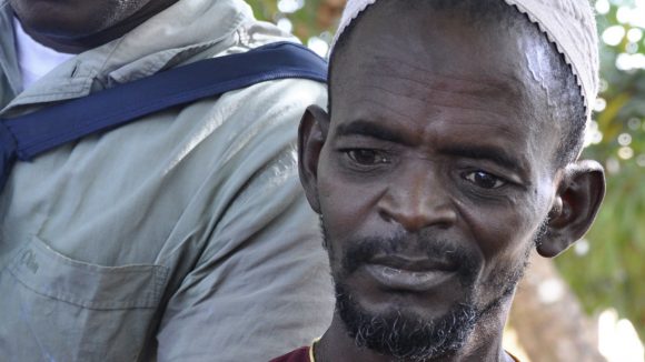 Mamadou looks at the camera.