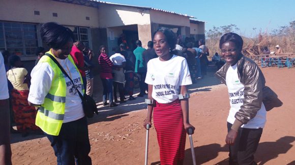 Three people with disabilities get together to fundraise.