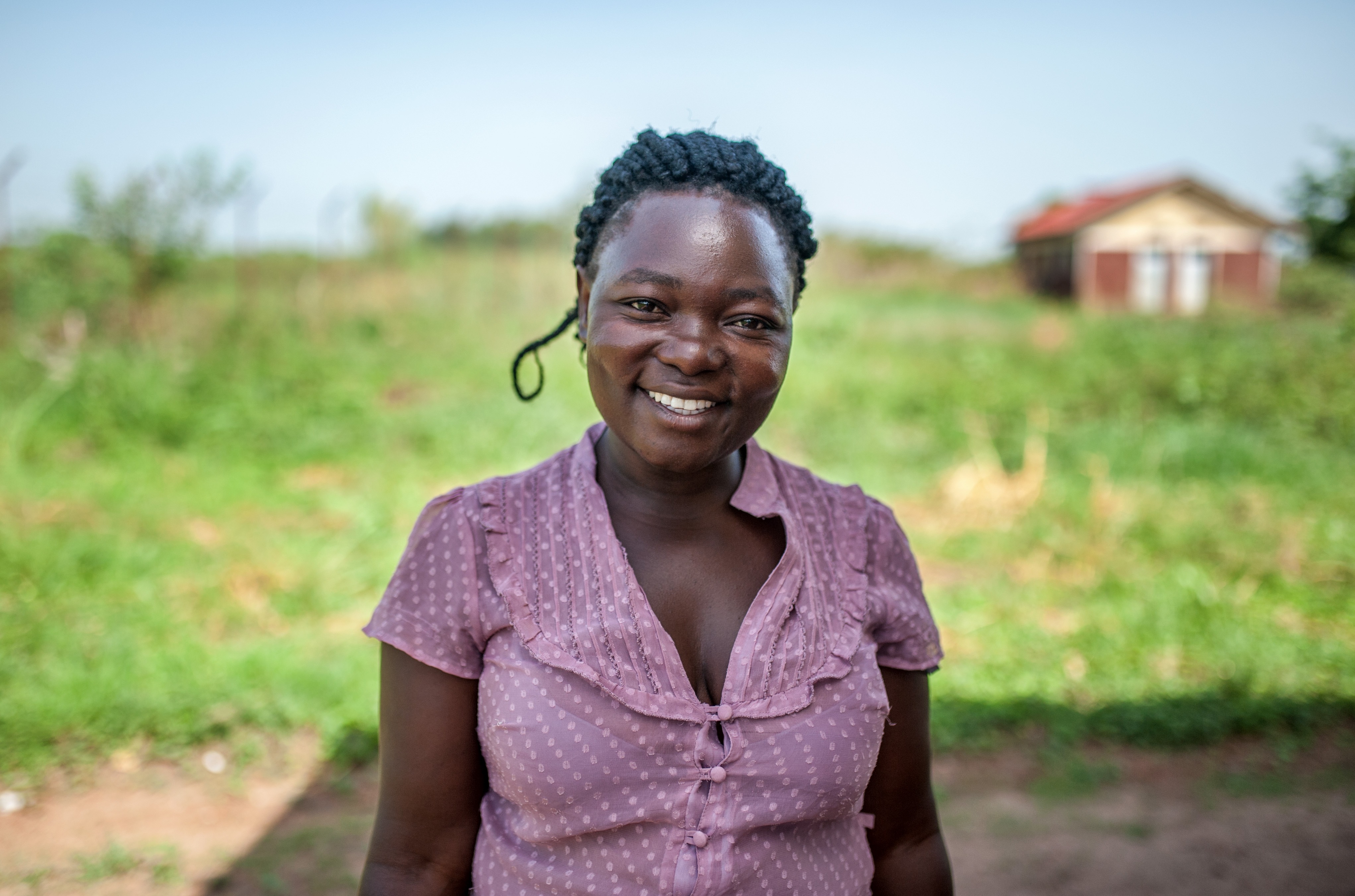 Arjuna Socia stands outside the Kibwoona Health centre in Masindi, Uganda.