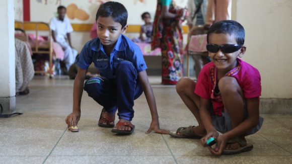 Mehidi plays with a friend.