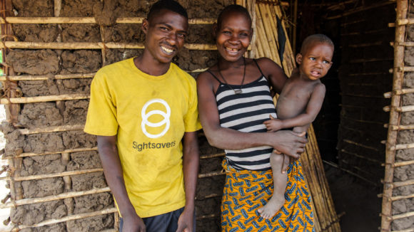Issa, Mayasa and Bibie outside their home