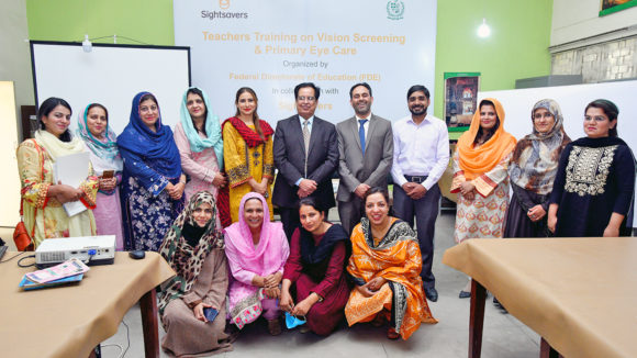 Teachers in Pakistan attend training to learn how to check their students' eyes.